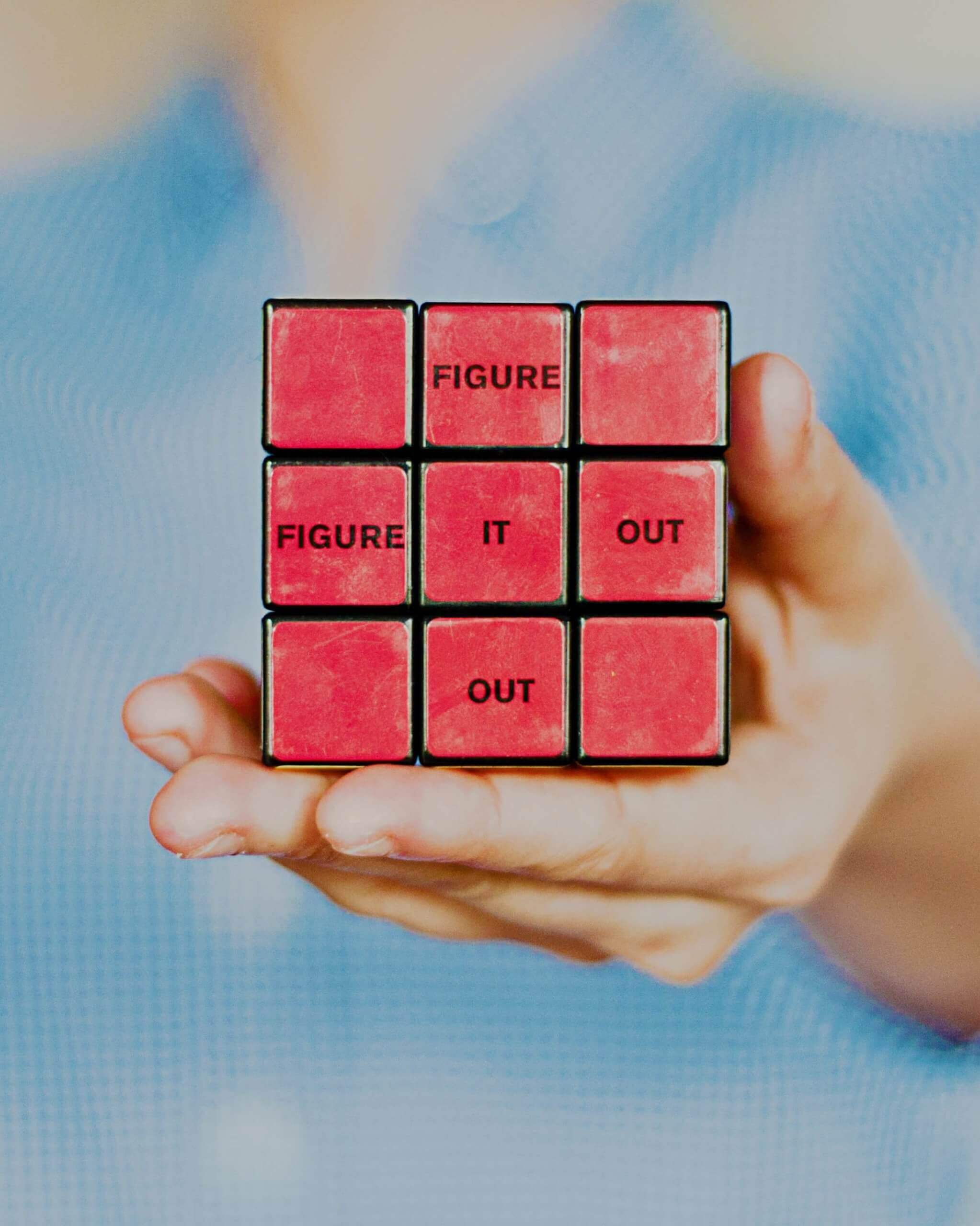 Red rubiks cube that says figure it out