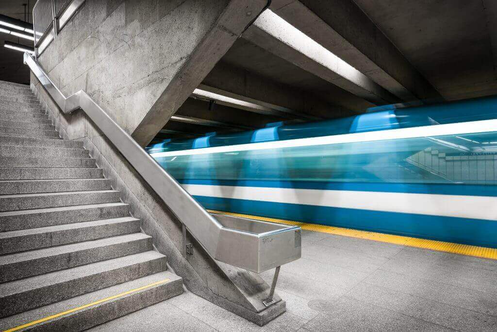 Subway station with subway blurring past