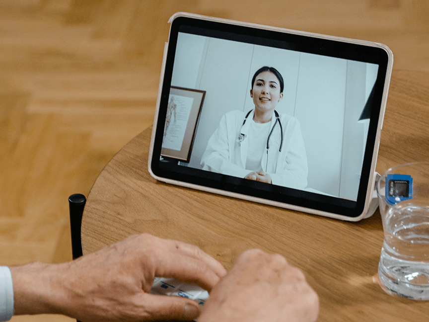 Physician on tablet during a telehealth visit