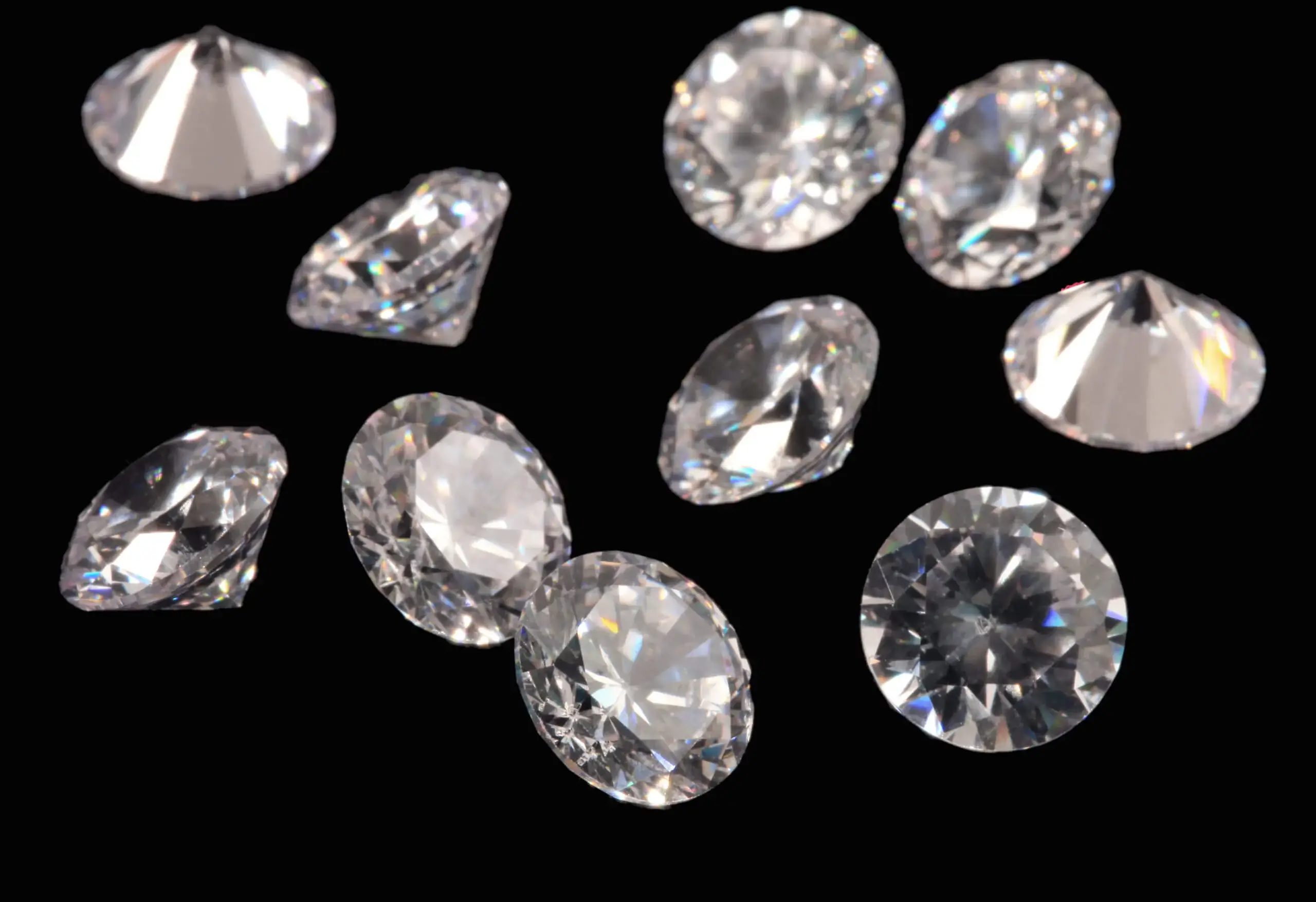 a bunch of different shaped diamonds on a black background
