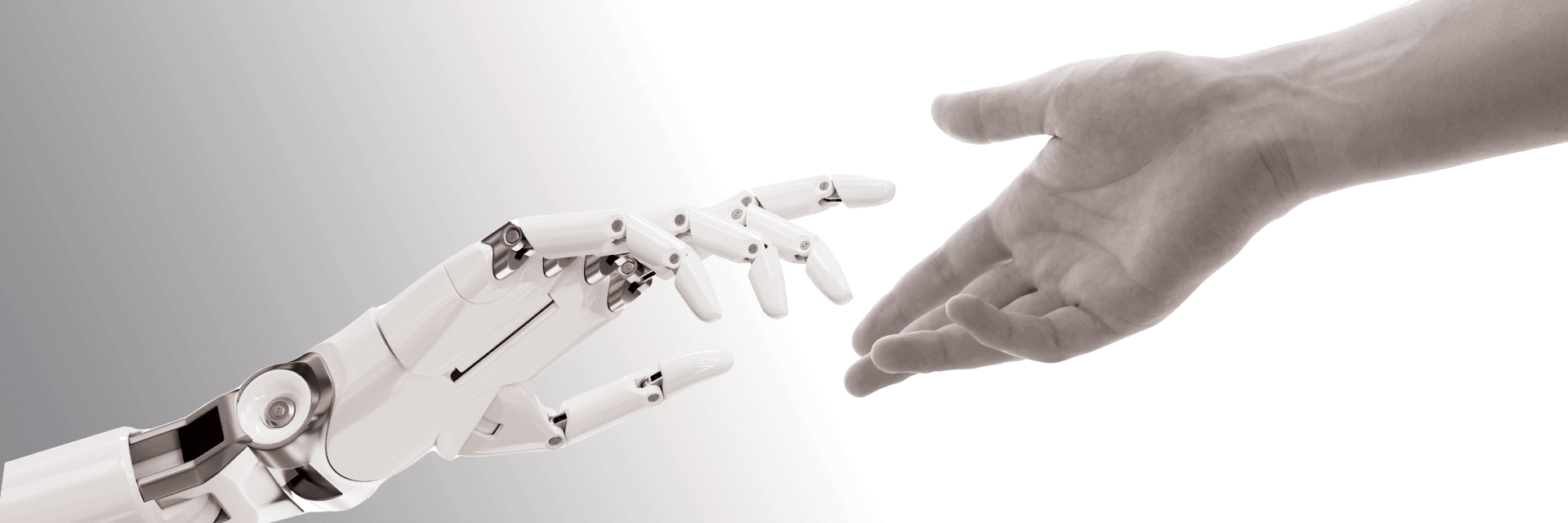 Une main robotique et une main humaine se tendent l'une vers l'autre