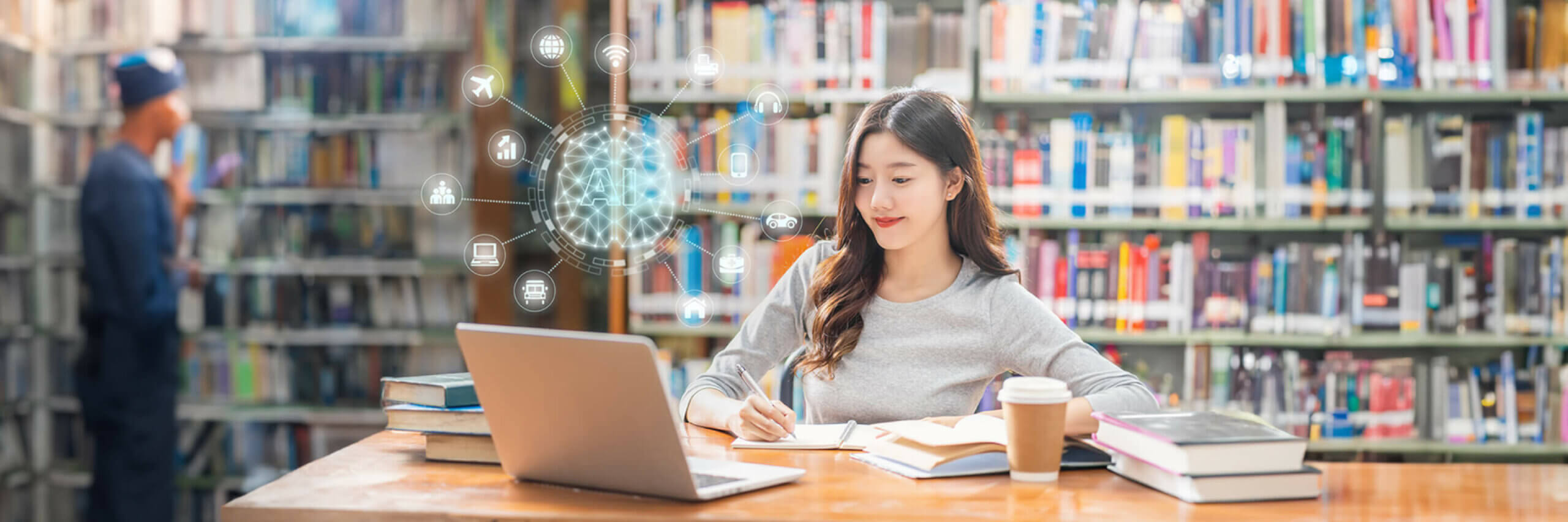 A woman in a library writing in a notebook and looking at her laptop. A glowing, holographic globe with AI symbols floats next to her.