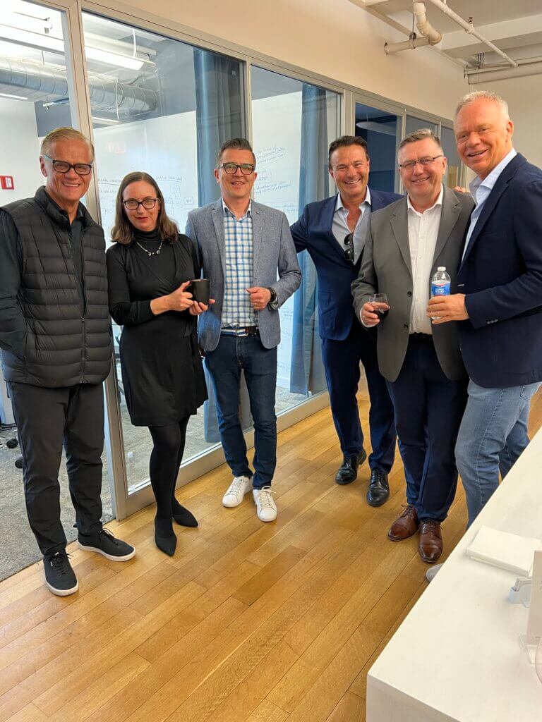 From left to right: Erich Joachimsthaler, Anne Olderog, Richard Rolka, and event attendees at the NYC office